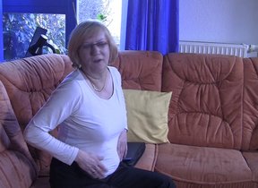 Mature German slut masturbating on the couch